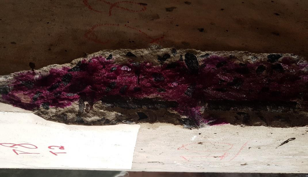 Carbonation-depth testing on reinforced concrete during the Acqua Marine investigation.