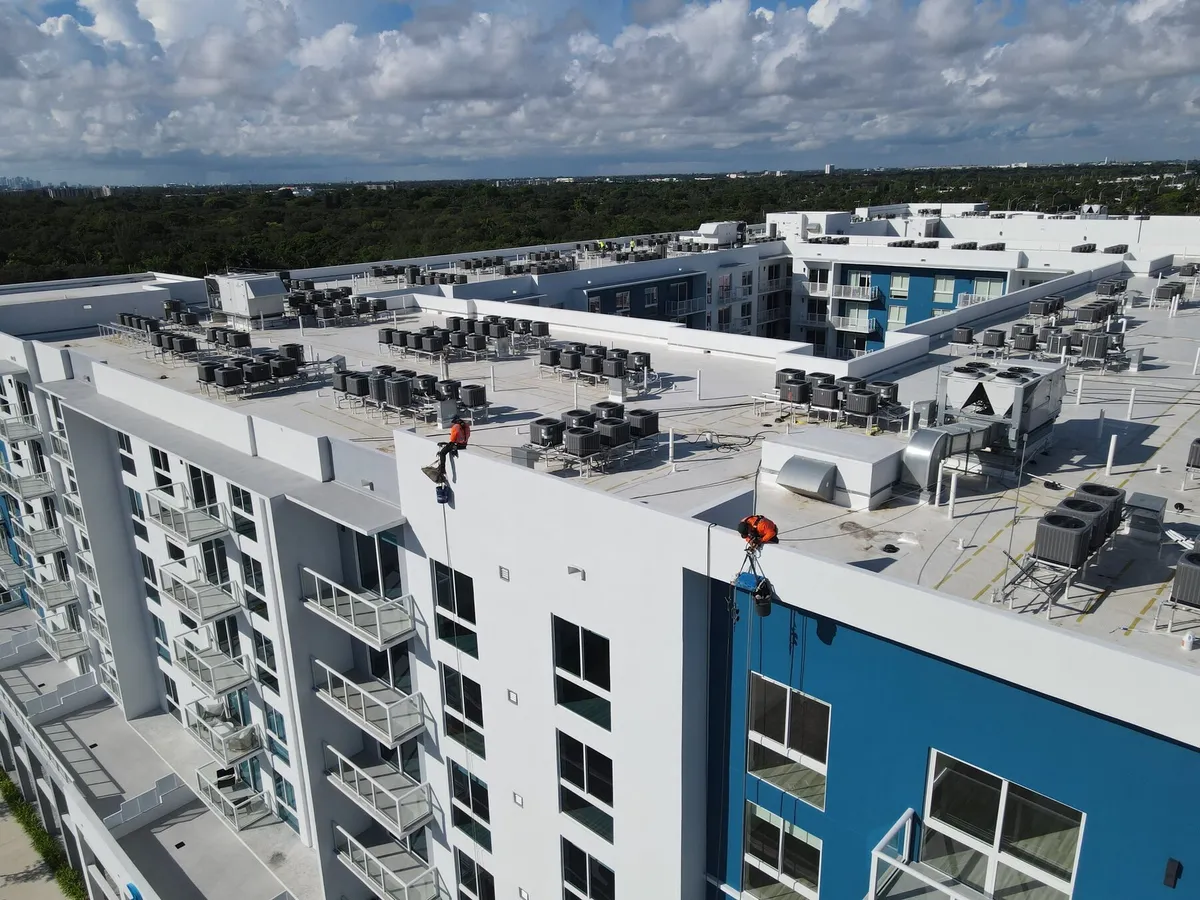 Aerial view of rope access rigging set up on a building roof